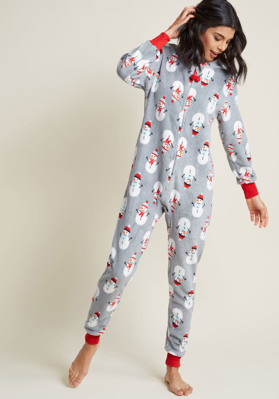81971 - Unwind at the end of a long day by snuggling into these grey pajamas and cozying up to your favorite book! As you fasten this loungewear's pom-pom-accented zipper, its soft fleece fabric envelops you