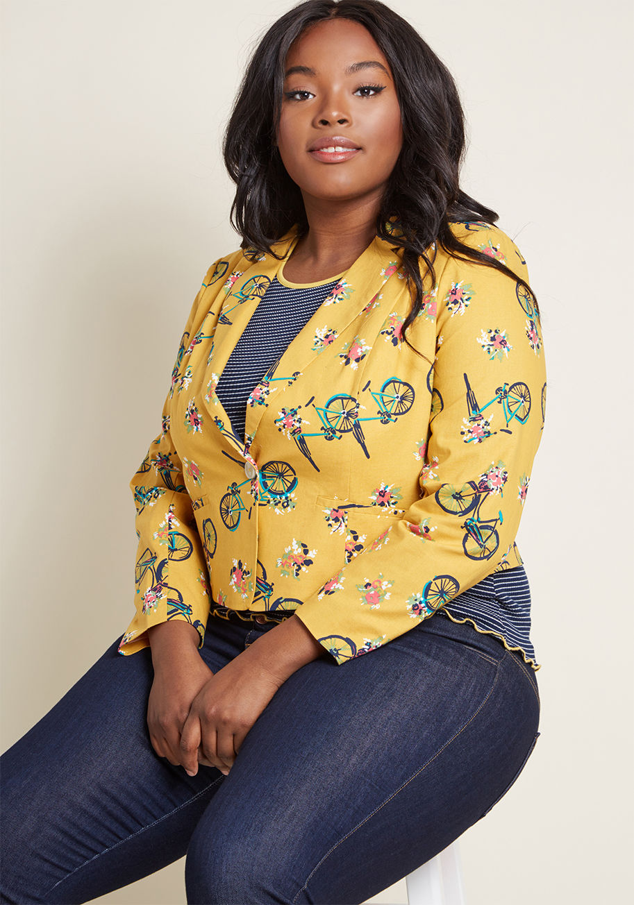 MCO1062A - Suit up and snap a photo - everyone on Earth will want to see how you style this goldenrod blazer! Part of our ModCloth namesake label, this cotton layer calls on an adorable pattern of flowers and blue bikes, shoulder pads, a single button closure, and f