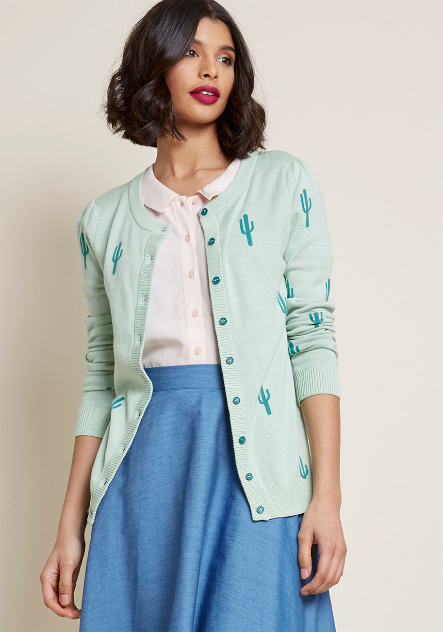 MCS1218 - Can't believe how much personality we've packed into this mint cardigan from our ModCloth namesake label? The only way to get on board is to give it a go! Layer the crew neck, ribbed trimmings, and quirky cactus print of this button-up sweater over any lo