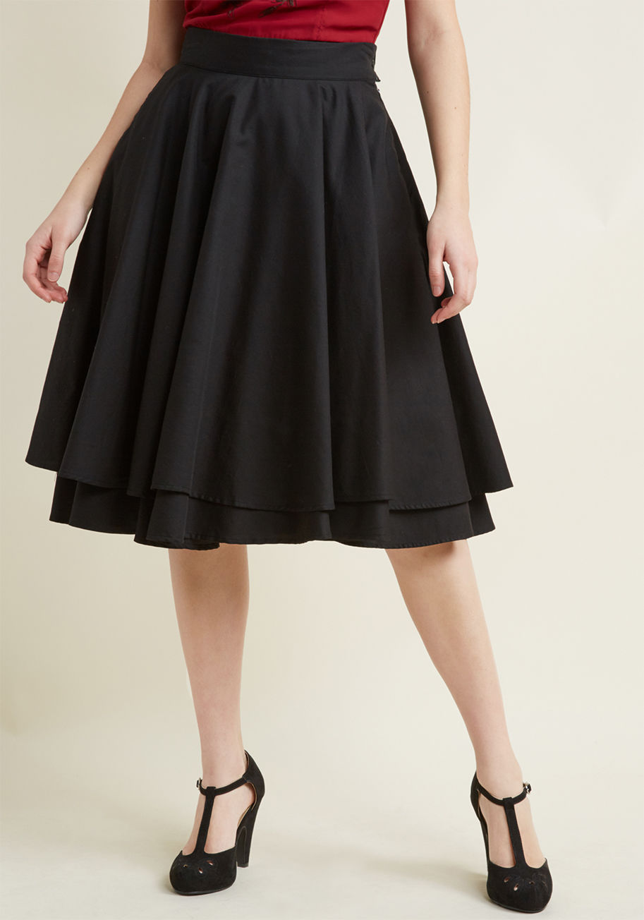 An elegantly full skirt is the perfect accompaniment for a variety of ensembles, making this basic - but hardly boring - black skirt a sartorial must-have. This ModCloth namesake label bottom features a lovely, double-tiered drape, a fitted waist, hidden  by MDB1003A