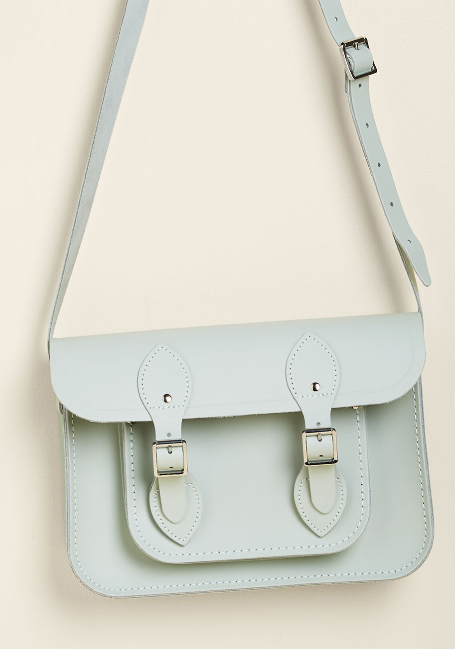 SAT111289MBN10101 - This pale mint, undeniably designed by The Cambridge Satchel Company, is absolutely saturated with classic style! A sturdy-yet-smooth, genuine leather composition hosts the handy magnetic buckles, luggage tag frame, dimensional front pocket, and essential