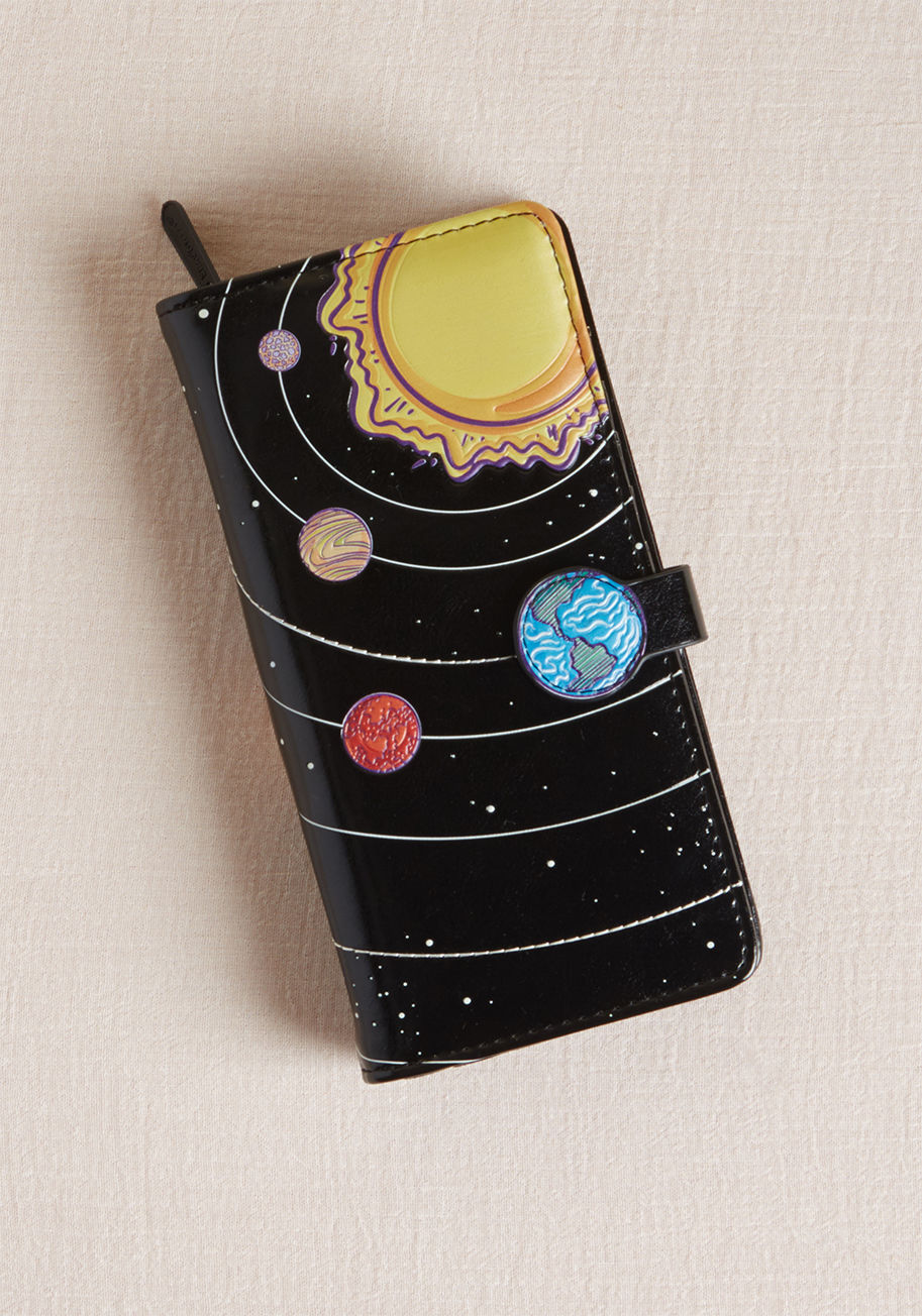 W009797 - Loading your cash and cards into this space-themed wallet is all reward and no risk! When you pull out the planetary motif of this black, faux-leather pocketbook to complete a transaction, fellow galaxy aficionados will gravitate toward its unexpected des