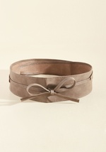 Sport this taupe belt on the dance floor to help define your fab figure while you're twisting and twirling! This vegan faux-leather sash features a slit on the side, so you can wrap its ends through and tie them by ABT5428