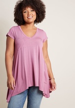 If laid-back looks make you bat your lashes, then this loose T-shirt will send your heart aflutter! Opposite its V-neckline, this ModCloth-exclusive tunic hides a hint of sweet style, while its shark tail hem and versatile white hue offer a rad way to rel by MCT1064