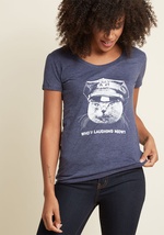 Patrol the grounds of comfort without losing your arresting style by putting your hands up and sliding on this tee! Emblazoned with a fierce, police-hat-wearing feline and the words &ldquo;Who&rsquo;s laughing meow?&rdquo; this funny find will keep your l by 