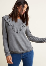 Casual and chic are your favorite fashion-related words, and this heather olive green pullover combines the two flawlessly! Flaunting a super-soft jersey knit and a super-cute ruffle creating a V on the front and back, this cute crew neck from our ModClot by Mct1406