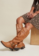 Before going out the door, add a little effortless edge to your look by employing these brown boots as your outfit's final touch! Crafted from textured faux leather that catches the light, the knee-high delights offer up their chic bronze buckles to provi by Bluebell