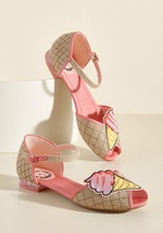 If ice cream wasn't already enticing enough, these Miss L Fire flats combine the cool treat with cute style to create an irresistible goodie! With glittery mini heels, gridded uppers, pink piping, and an applique at each peep toe, these darling d'Orsays s by 