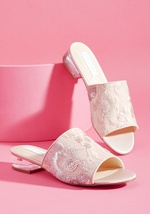 When it comes to these blush pink slides from Betsey Johnson, luxurious detail is by 