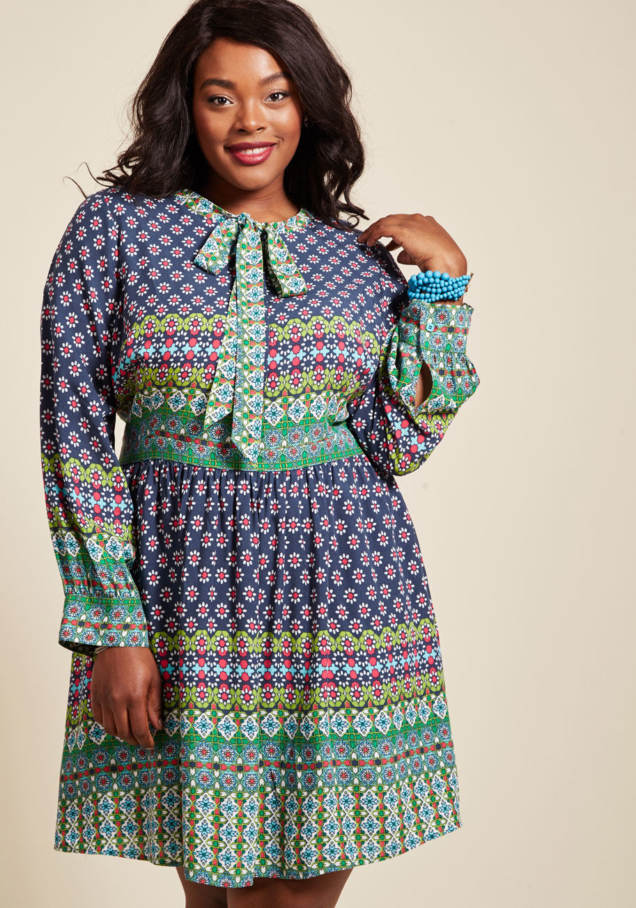  - All the desirable details of this navy blue shirt dress come together to make it your best look yet! Take a closer look at the tied neckline, square-shaped bodice buttons, and kaleidoscopic pattern accenting this floral ModCloth namesake label frock. Pair
