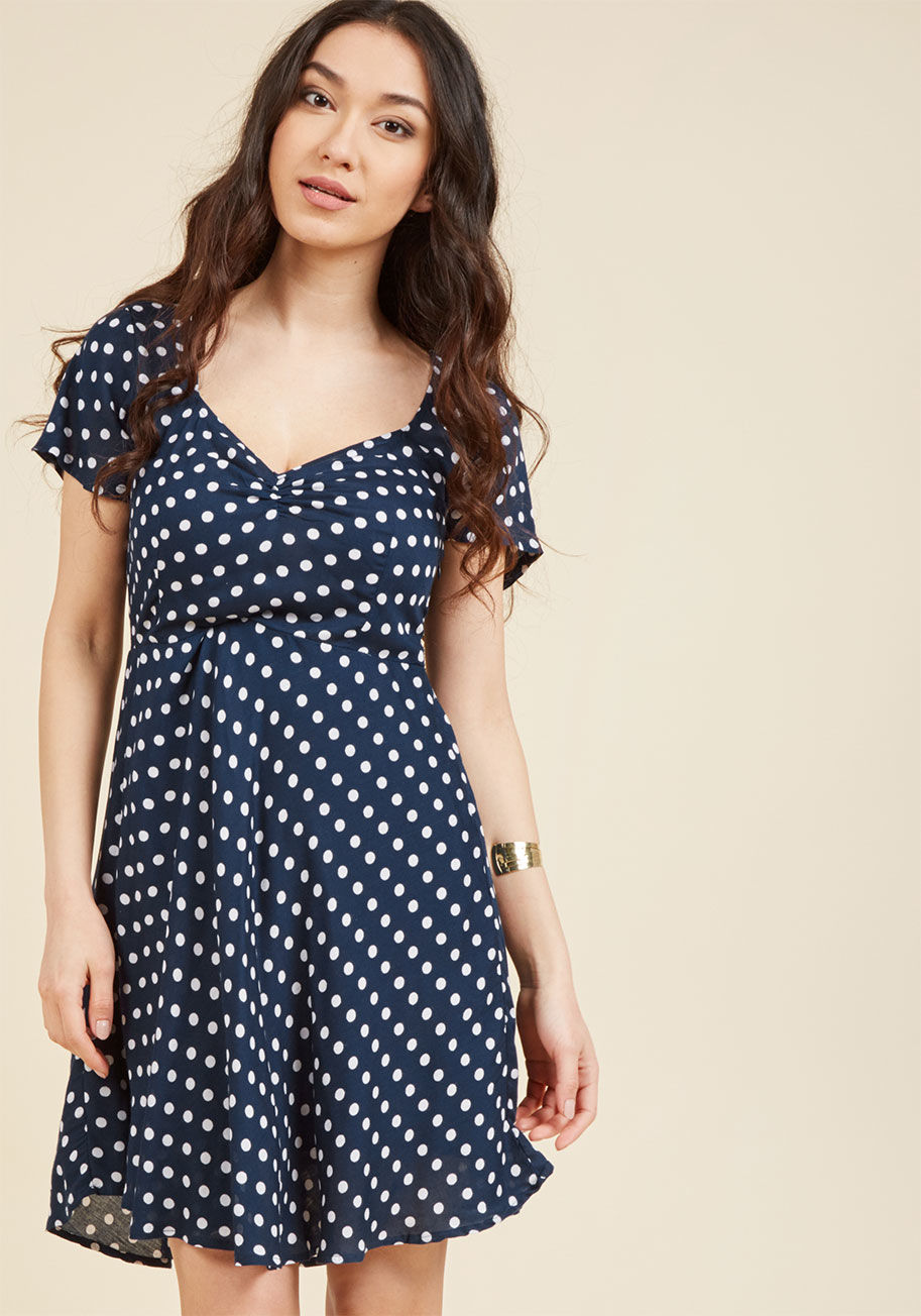  - Anytime you're up for a quaint neighborhood stroll, this ever-so-fitting navy blue dress will be closeby and waiting to join you! Whimsically speckled with white dots, adorably ruched at the sweetheart neckline, and offering a swingy, lightweight woven si