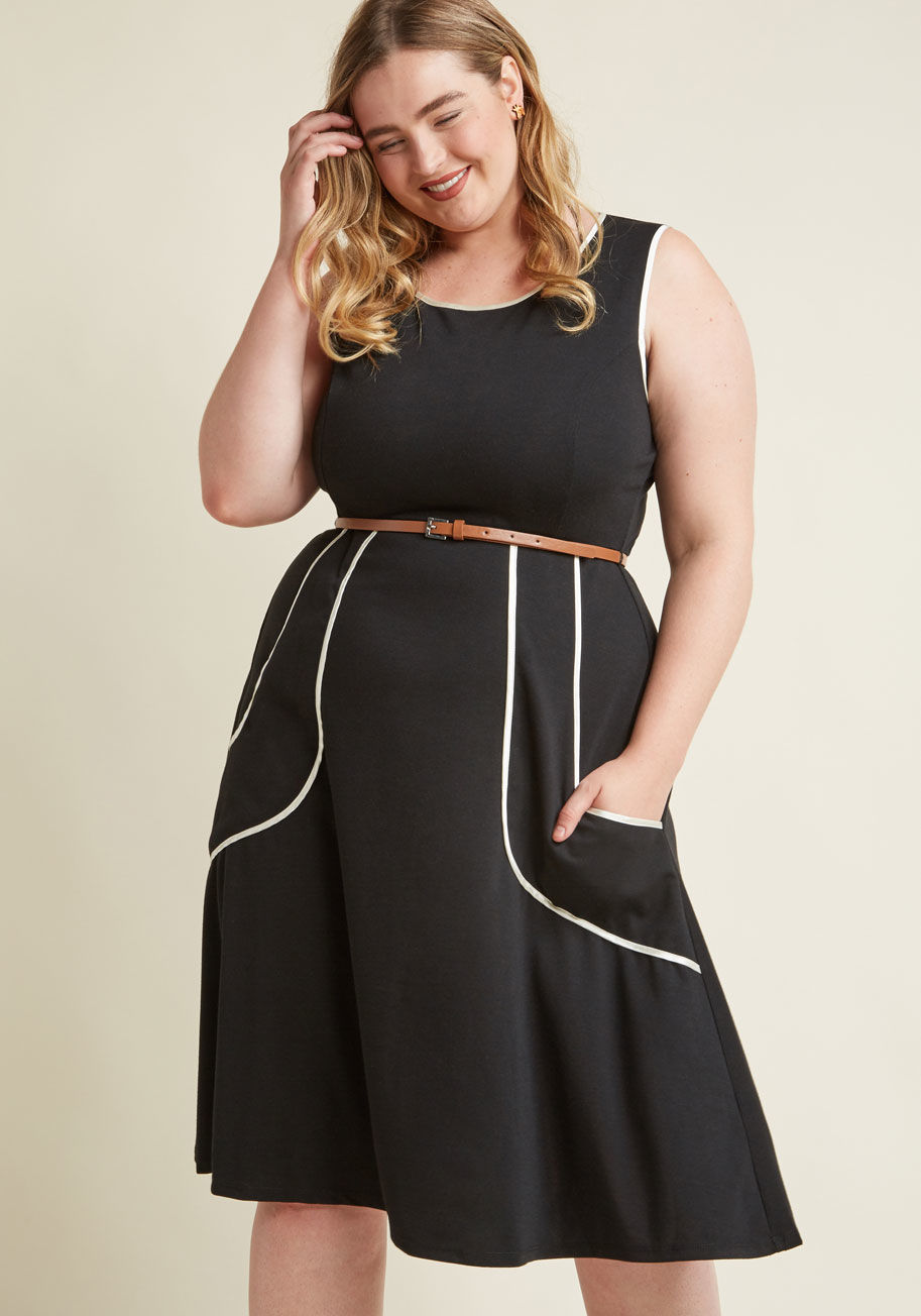 As a professional genealogist, your style is inspired by many eras. Show up to the office tomorrow wearing this black dress, which boasts princess seams, a cute keyhole closure, and drop pockets that'll make your coworkers swoon! Finished off with white s by 