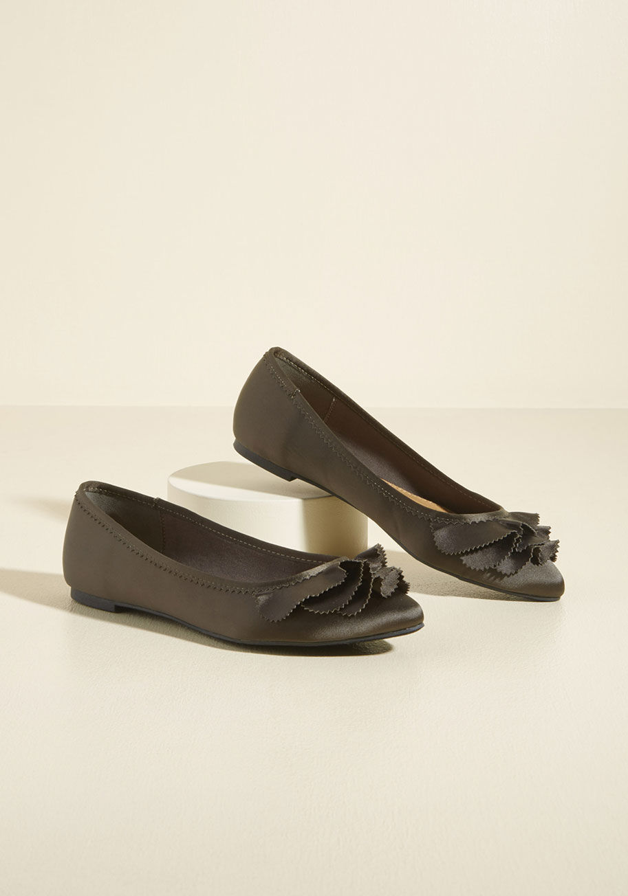  - Ballet flats are a fashion classic, but it's the rows of ruffles atop these deep green skimmers by Report Footwear that elevate this style to full-on-favorite status! In addition to a satin sheen and edgy pinked trimmings, this sensational pair offers up 