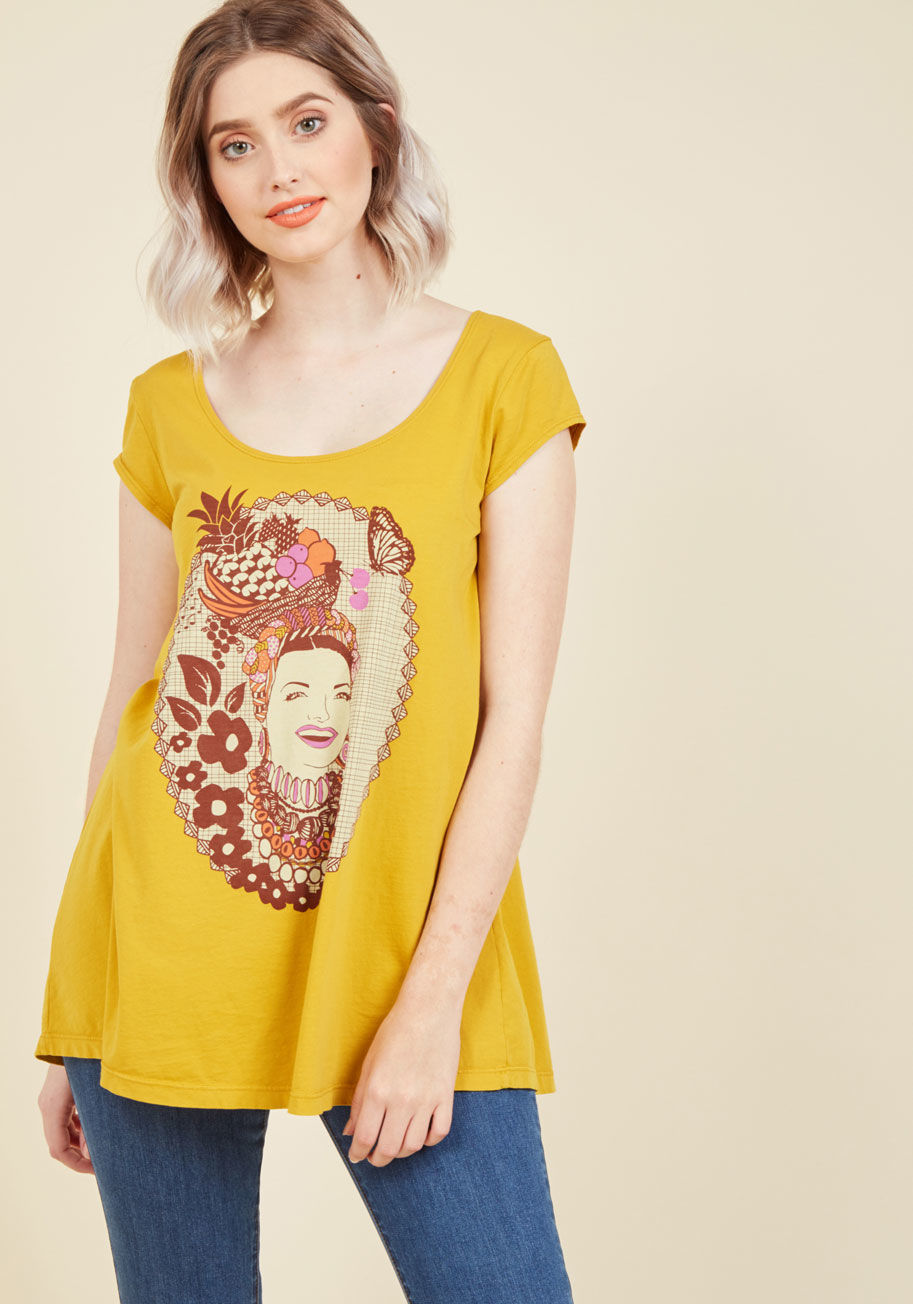  - Between this cotton T-shirt's chipper marigold hue, A-line cut, and joy-inspiring graphic of one rightfully iconic film star, it's almost impossible to feel anything but incredible while flaunting it! By LA-based and environmentally-aware brand Blue Platy