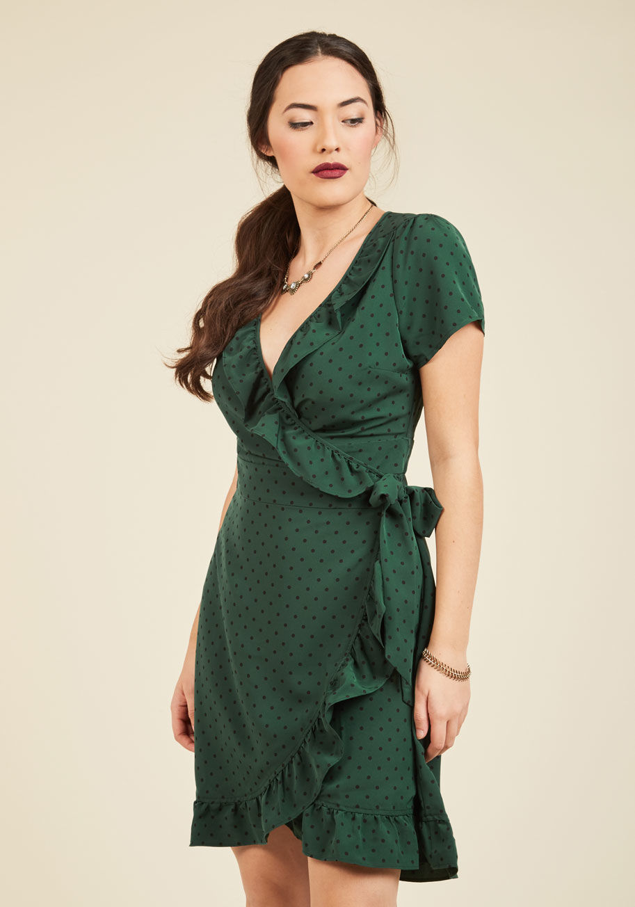  - Busy and beautiful can coexist with this ModCloth-exclusive wrap dress on hand! Twirl into this tied piece&rsquo;s forest green hue and fun black polka dots, welcoming its gathered back accent and ruffled edges to bring a fun flirtatiousness to all your t