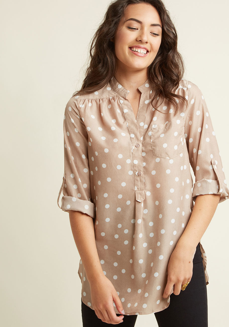  - Celebrate your family's arrival with the white polka dots on this rich yellow top! A curved hemline vents your outfit while you run around with the little ones. Featuring light material, a chest pocket, and roll-to-button sleeves, this top makes your job 