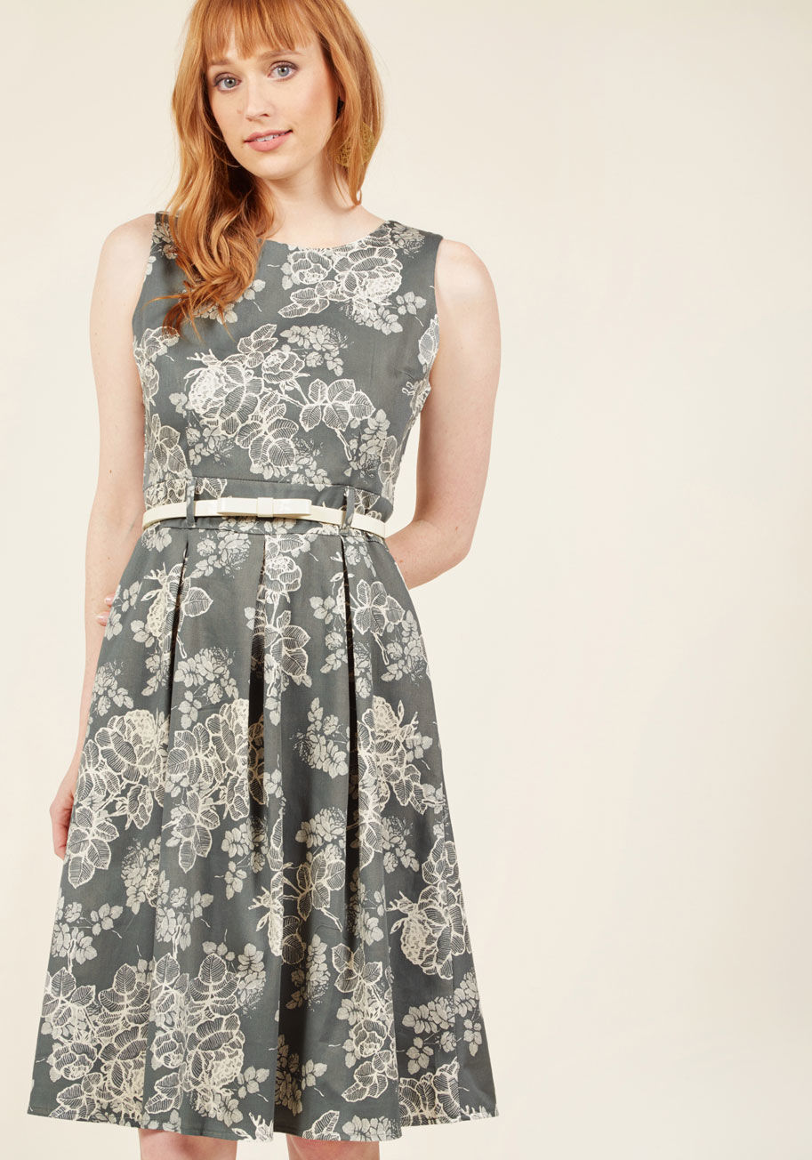  - Combining your sparkling personality with this grey midi dress for the networking event will prove to be quite an adventure! The ivory floral print, belted waist, and crisp pleats of this vintage-inspired A-line break the ice with newcomers, as your skill