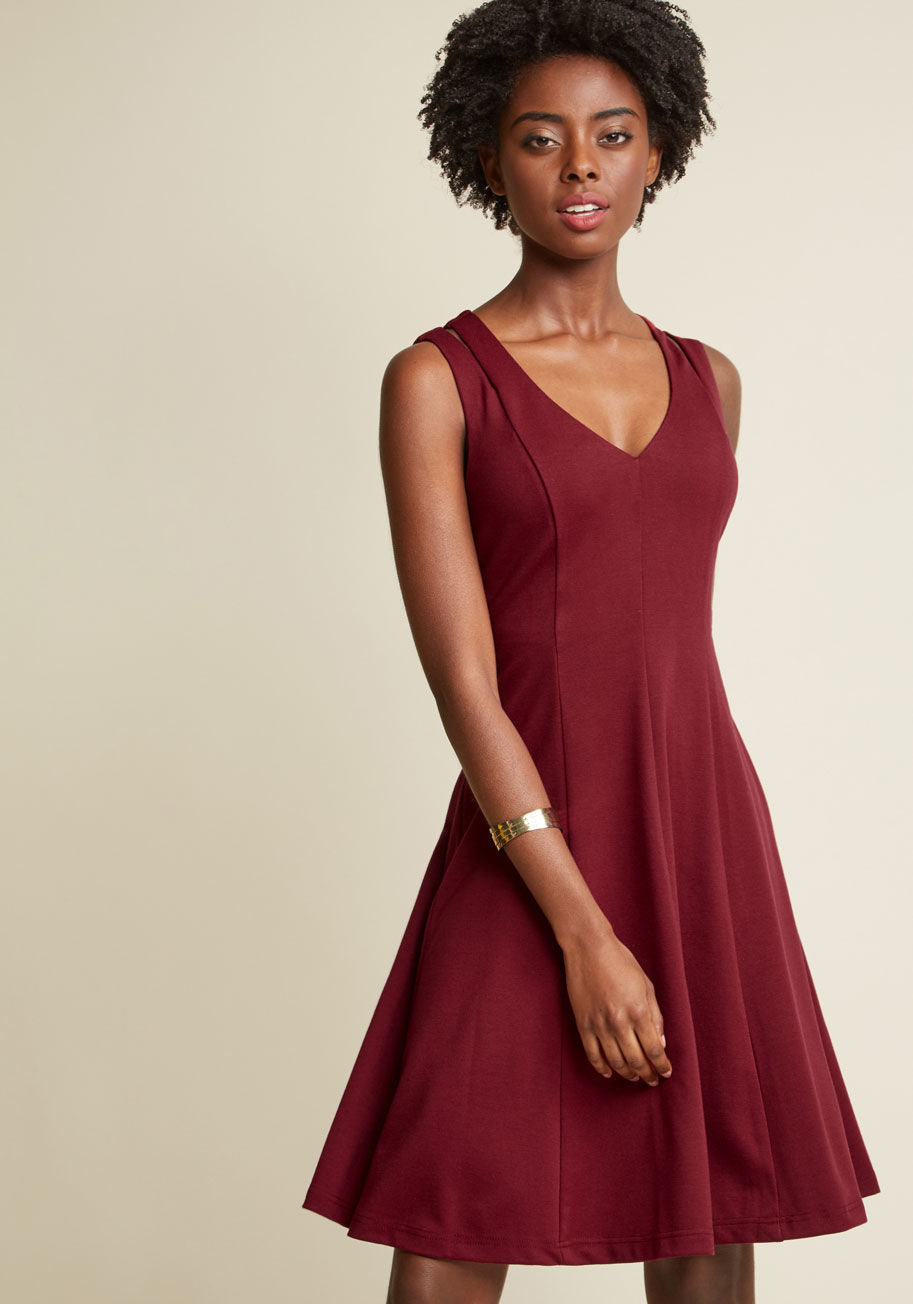  - Elegant with a bit of edge - that's what this deep red, knit dress adds to your list of looks. With voguely vented shoulders, a V-neck, and a collection of vertical seams that flatter your figure, this ModCloth-exclusive A-line is a true 'do'.