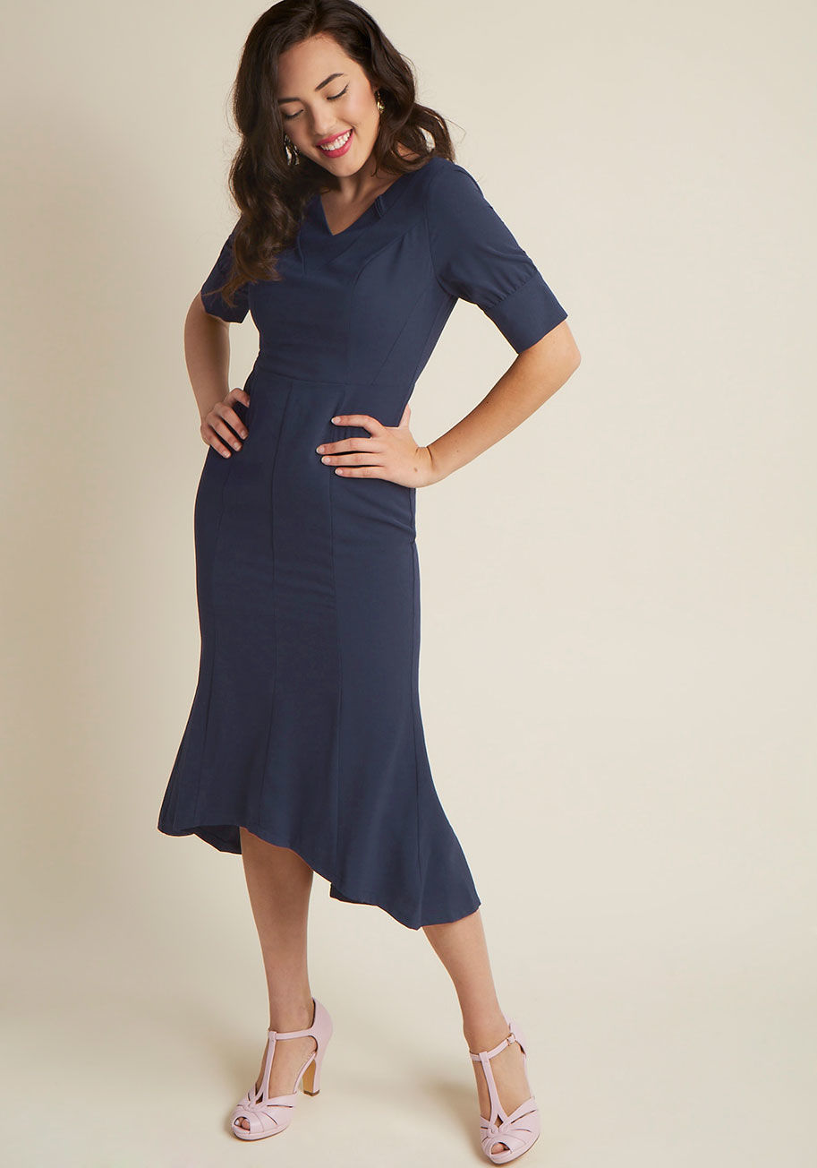  - Film noir fashion doesn't get any better than this navy sheath dress - a ModCloth exclusive! Taking it back to our love of vintage-inspired style, this figure-highlighting frock radiates nostalgia via delicate pleats along its V-neckline, thoughtful bodic