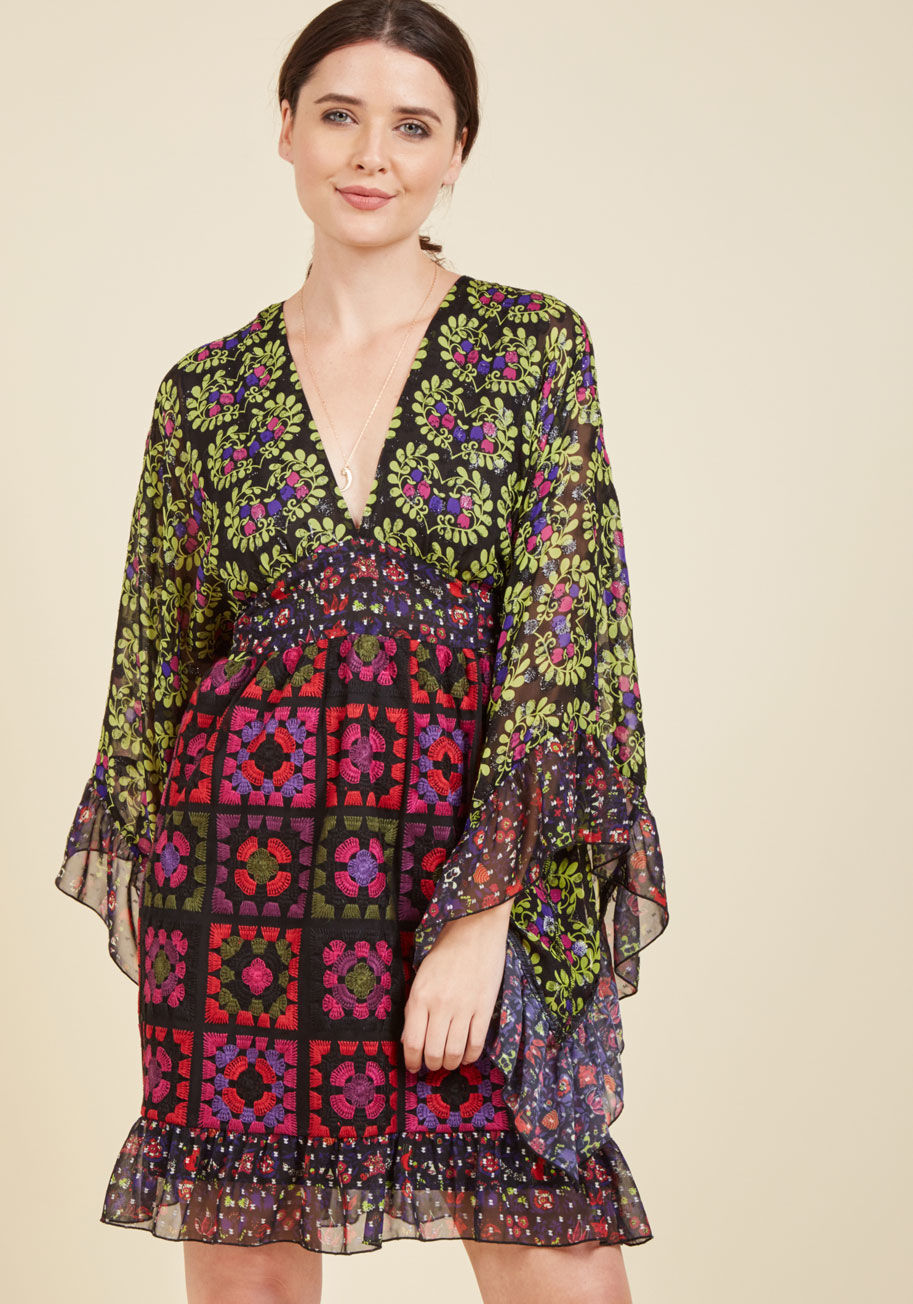  - For the gal whose style is anything but expected, this black dress from Anna Sui is guaranteed to be your next show-stopping piece. In addition to varying floral prints, metallic dots, and dramatic bell sleeves, this stunning frock touts an embroidered sk