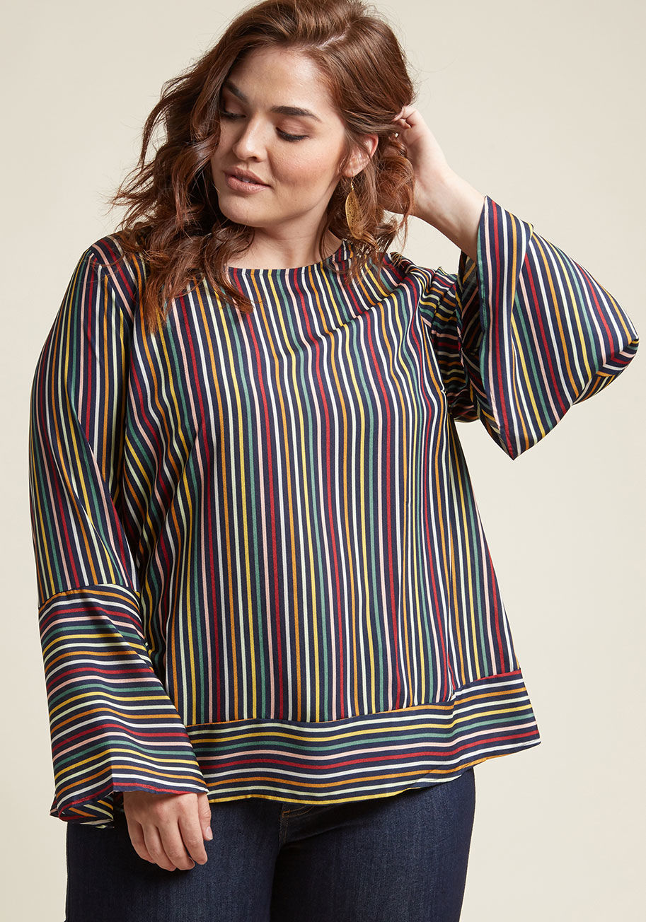  - Forget looking to the calendar to find the perfect moment for showing off this striped navy top! From Sunday to Saturday, this multi-hued beauty promises a most impactful look, all thanks to its dramatic bell sleeves, button-up back, and banded waistline.