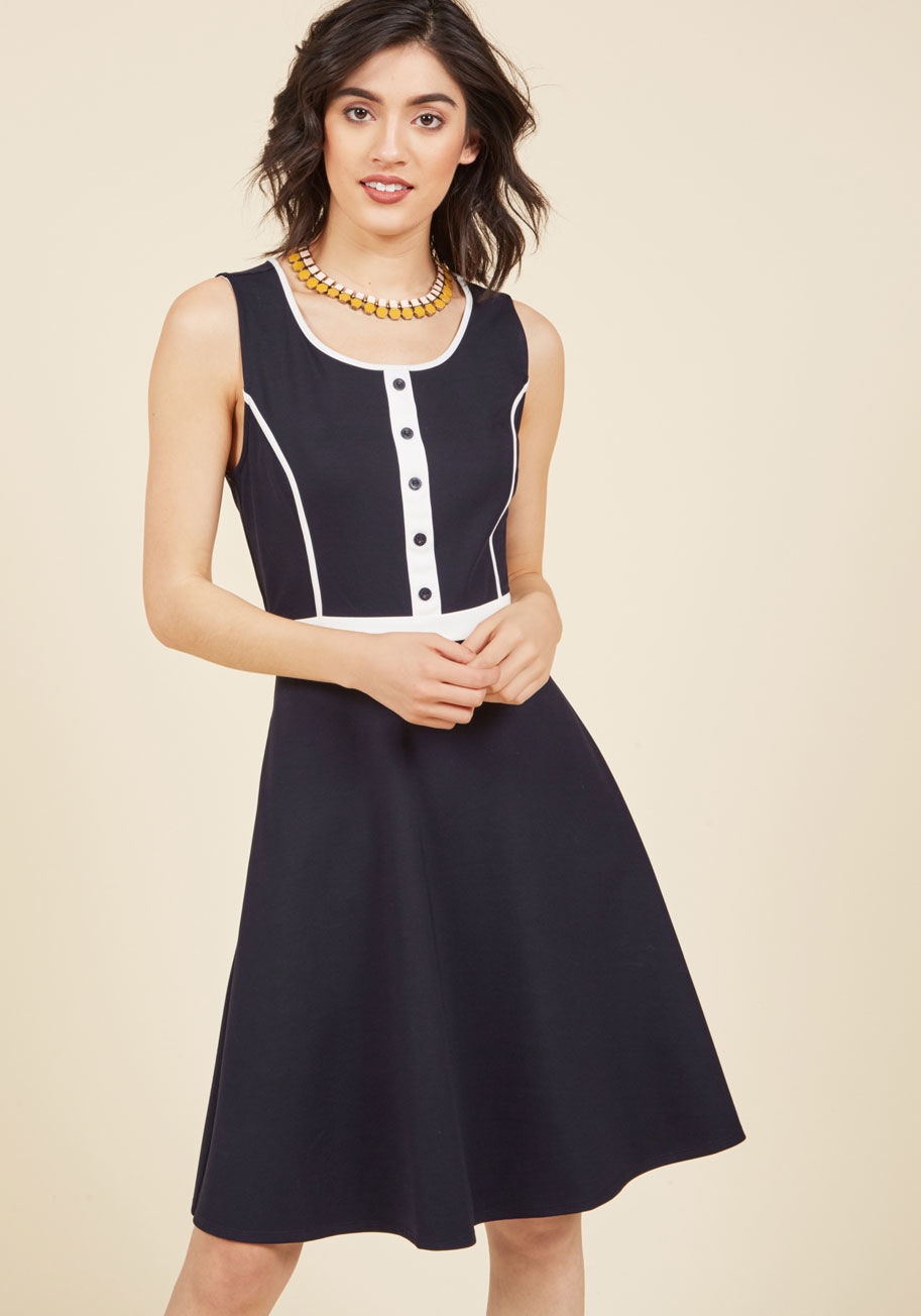  - From wayfaring journalist to wondrous fashionista, this navy dress exudes your expertise across the board. Part of our ModCloth namesake label, this pocketed frock features white piping, a buttoned placket, and work-ready appeal that leaves you wanting to