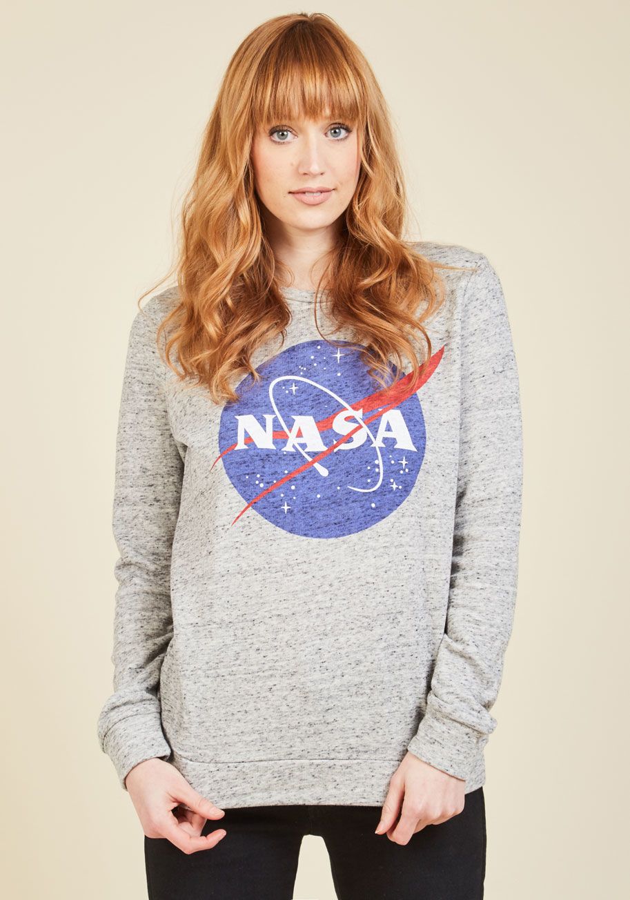  - If a smart sweatshirt has been on your radar, it must have been light grey pullover activating your sensors! Decorated with the sigil of NASA, and touting a crew neck and mottled knit, this terry top is an interstellar option for the gal with dreams of ga