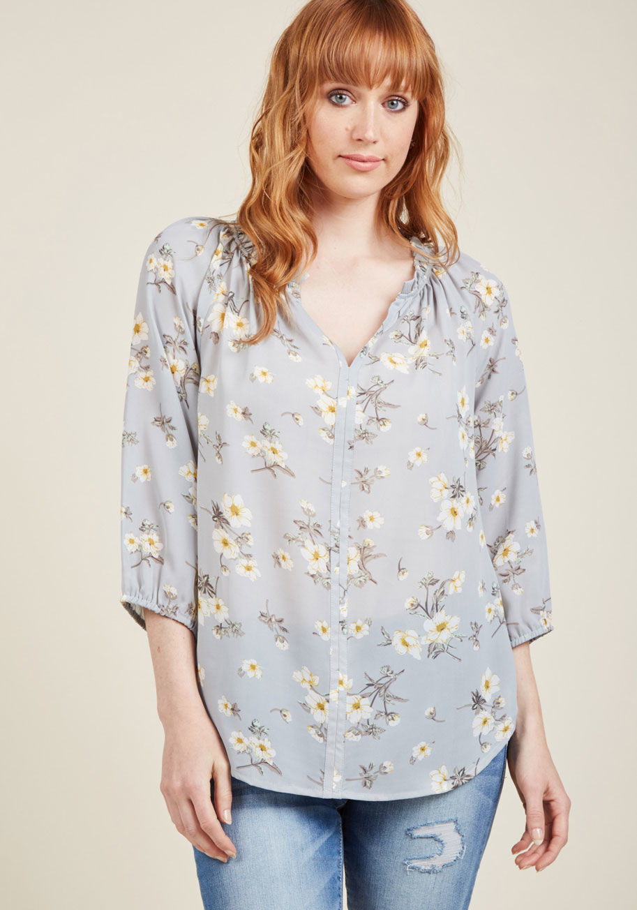  - Imbuing your look with a hint of botanical bliss is easy with this grey blouse! In the time it takes you to pull the ruffled, notched neckline, cropped sleeves, and ivory floral print of this sheer blouse over your head, you'll have created a refreshing l