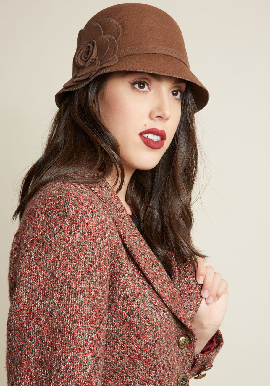 In an effort to keep retro style close at hand, you always have this brown wool cloche hanging by your door! That way, it's easy to grab this hat on your way out the door, and flaunt its grey stitching 'n' flower applique on the reg. by 