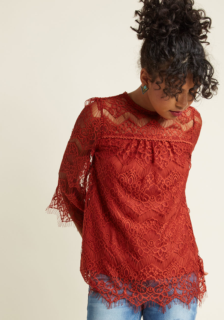  - In the elegant lace motif of this navy blue top, it&rsquo;s easy to stay on the subject of your blissful lifestyle! Cropped sleeves with eyelash trim and a sheer neckline detail this beautiful blouse, and keep your graceful look on the tip of everyone&rsq