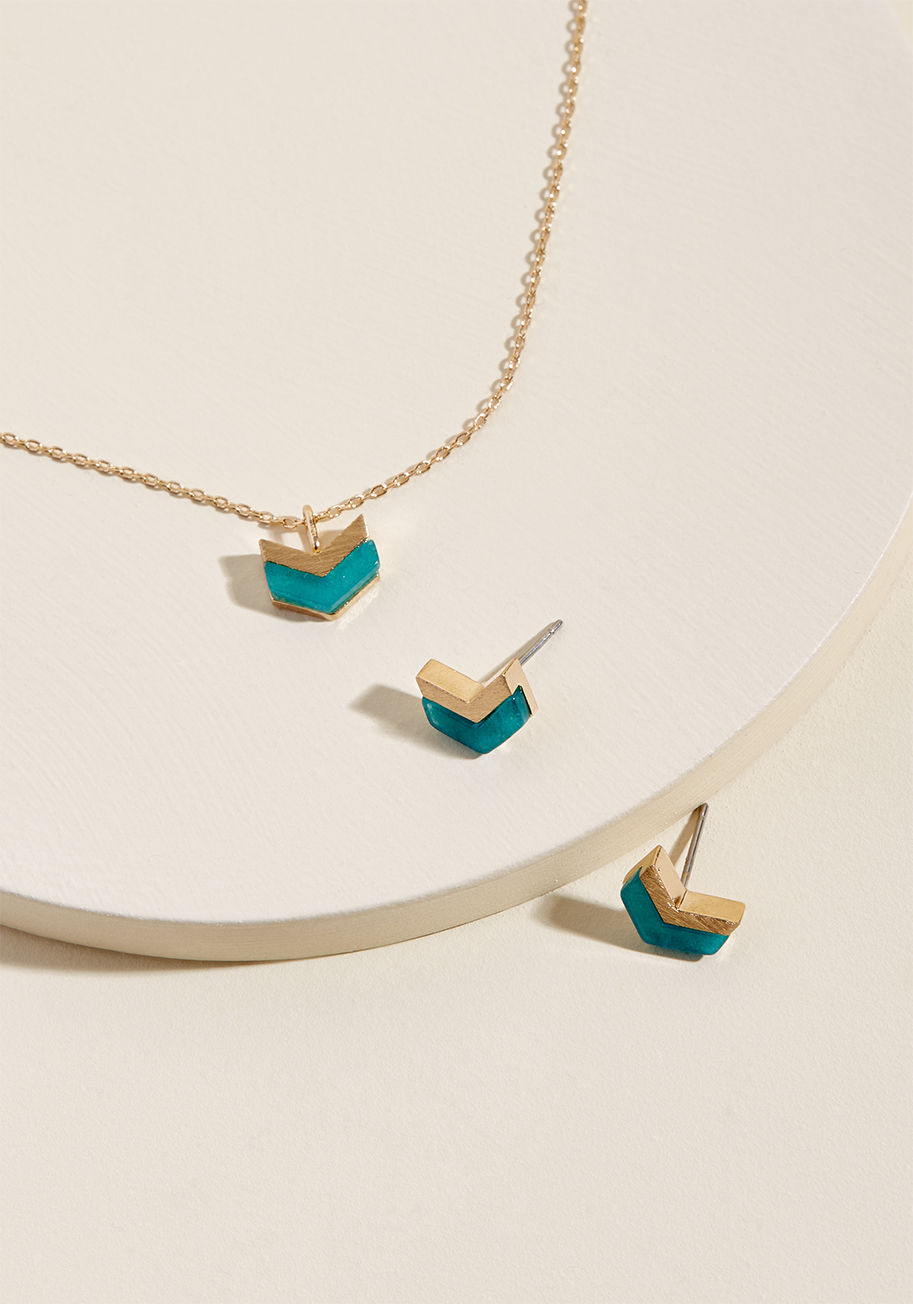 In the pretty peppering of polish this necklace and earring set provides, you'll feel primed and ready to handle whatever the day throws your way! The gold-and-silver chevron motif atop the pendant and each stud of this adornment duo makes a thoughtful st by 