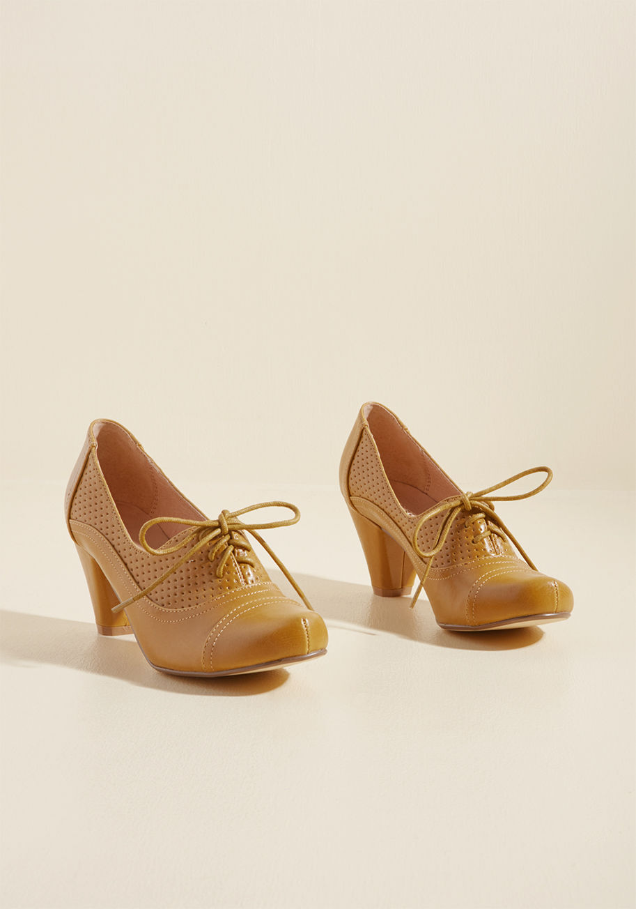  - In these Oxford heels, your presence and fashionable panache will make themselves known! A classy offering from Chelsea Crew, this vintage-inspired pair touts rounded toes, walkable tapered heels, and a panel of perforations, all