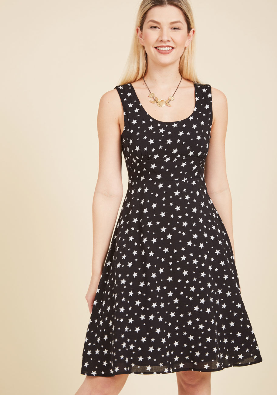  - In this black midi dress, you&rsquo;re rarin&rsquo; to share your secrets to stellar style. First, you look for a print as standout as this frock&rsquo;s white stars. Next, you figure