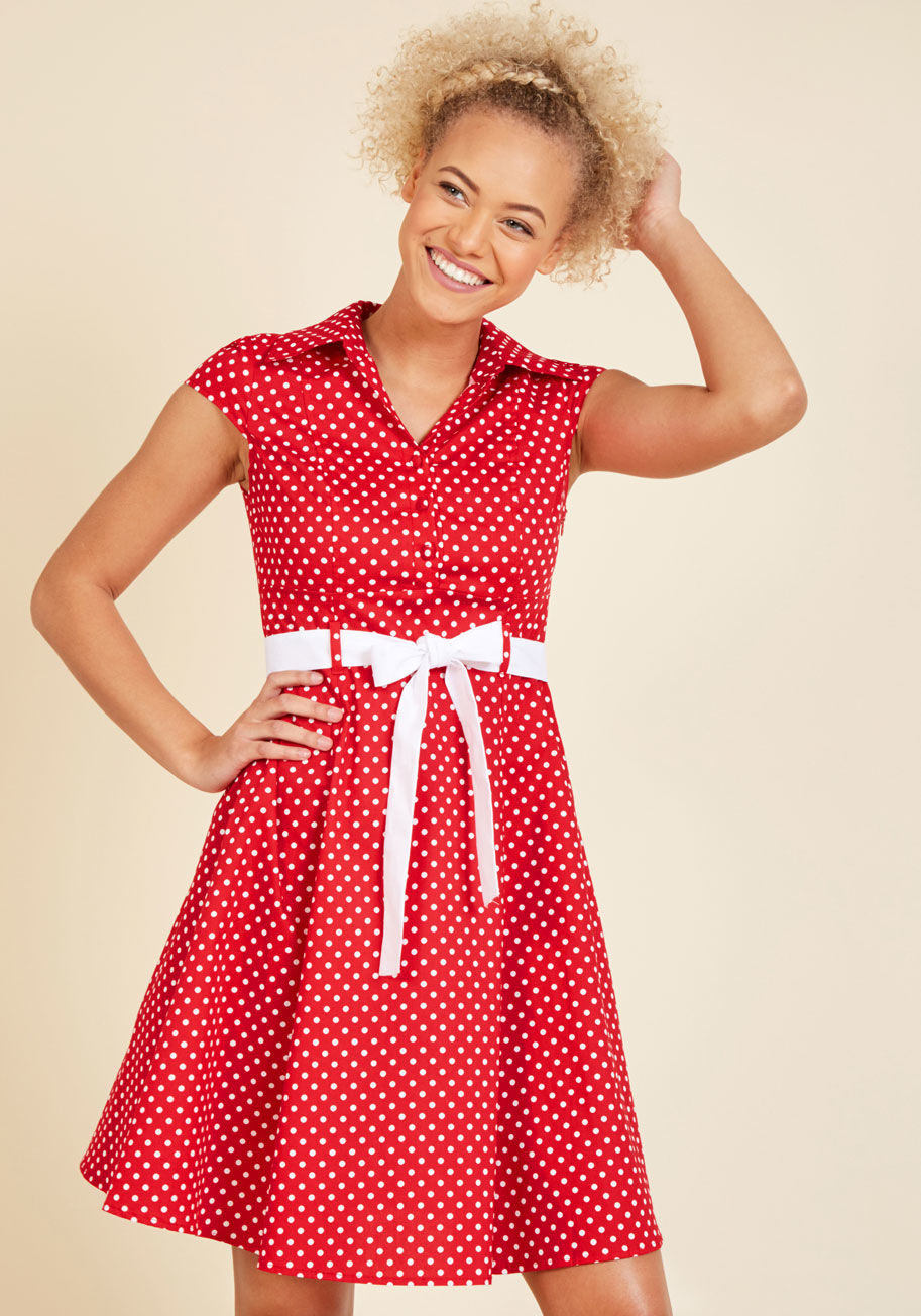  - In this &lsquo;50s-inspired shirtdress, your date at the ice cream parlor is a stylish one! The bright orange hue, fabric-covered buttons, and slight stretch to the cotton blend of this eye-catching dress make it a cute wear