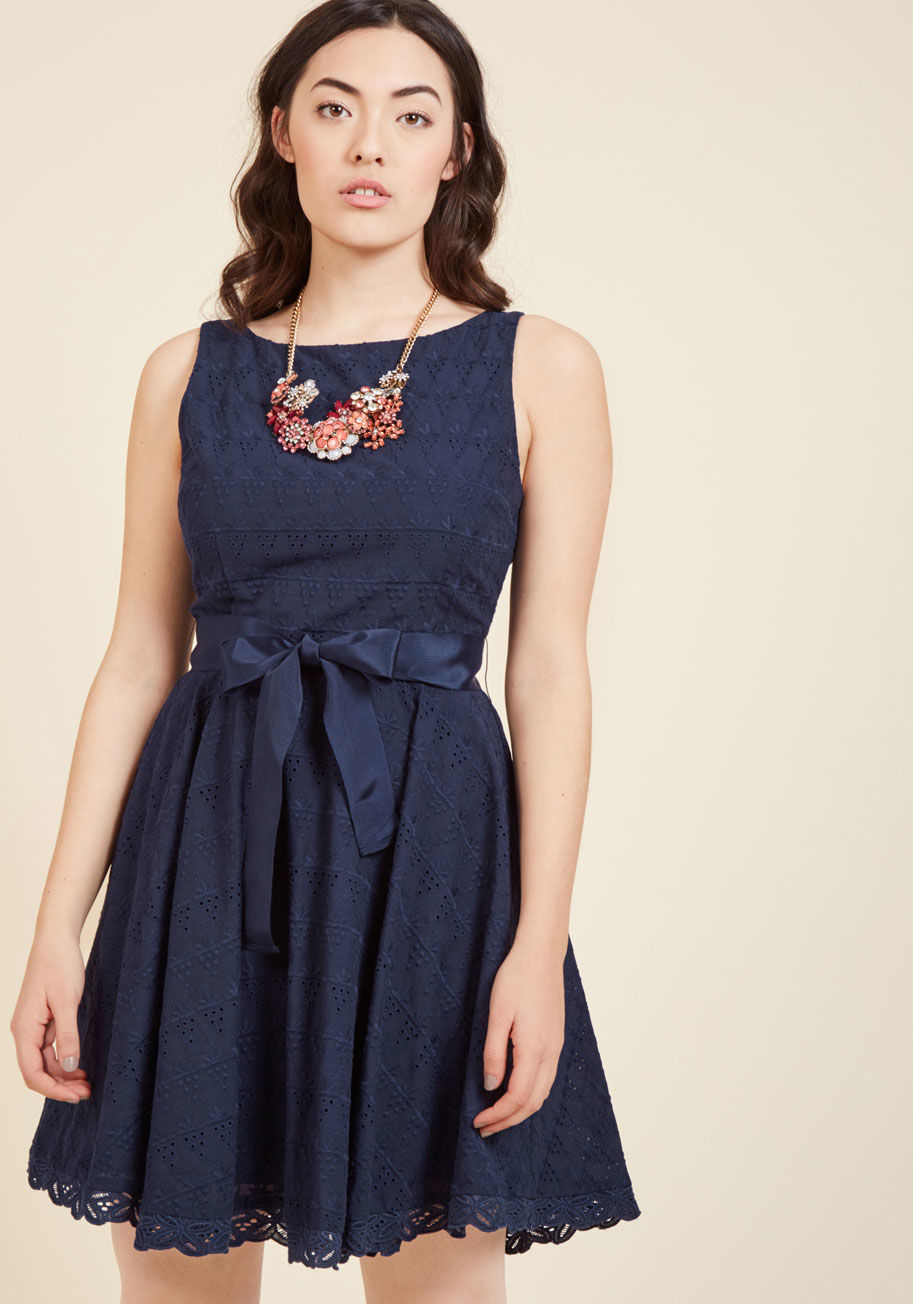  - In your mind, there's no other option but to sport this navy blue sundress for a sunny Sunday drive! The eyeleted-and-embroidered grape pattern of this BB Dakota A-line may just inspire a fruit stand stop - aka an extra chance to flaunt its ribbon sash an