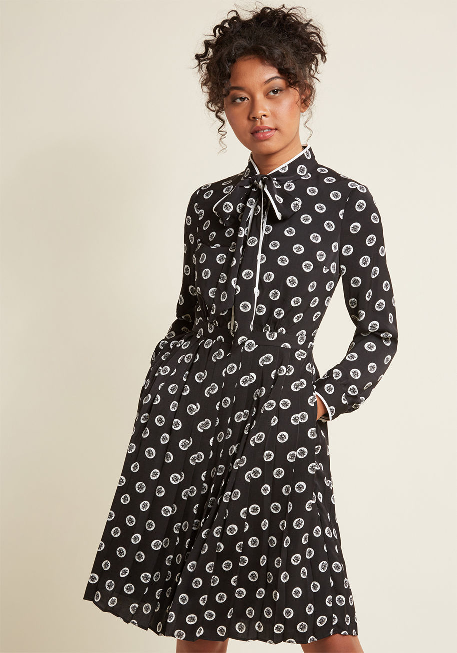  - It's polished, it's personality-filled, and it's part of our ModCloth namesake label. It's this satiny black shirt dress and its flower-filled polka dots are soon to be your favorite print to wear at the office and on evening outings alike! Affixed with a