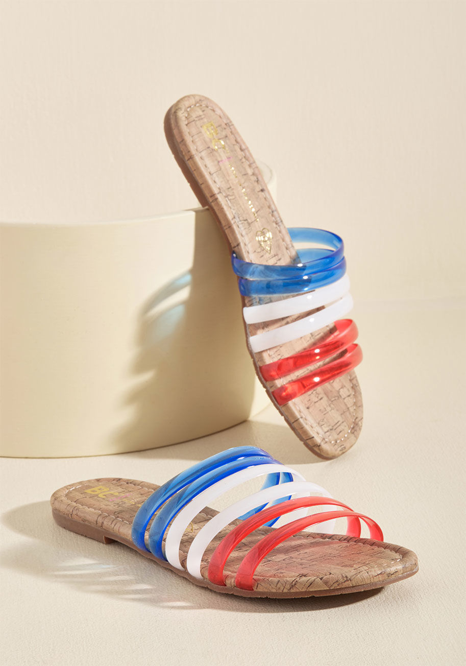  - Let these red, white, and blue sandals proclaim your favor for a day spent frolicking! BC Footwear serves up these sassy slides with jelly bands, cork-inspired footbeds, and a playful attitude that encourages you to 'hues' your imagination for making the 