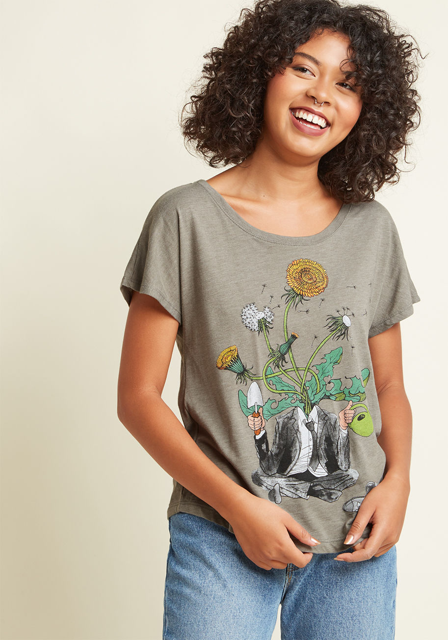  - Let this grey T-shirt encourage your imagination to grow and grow! In addition to seamless short sleeves and a scoop neckline, this whimsical tee boasts an attention-grabbing graphic of a dandelion-headed dude, who serves as a reminder to nurture and cult