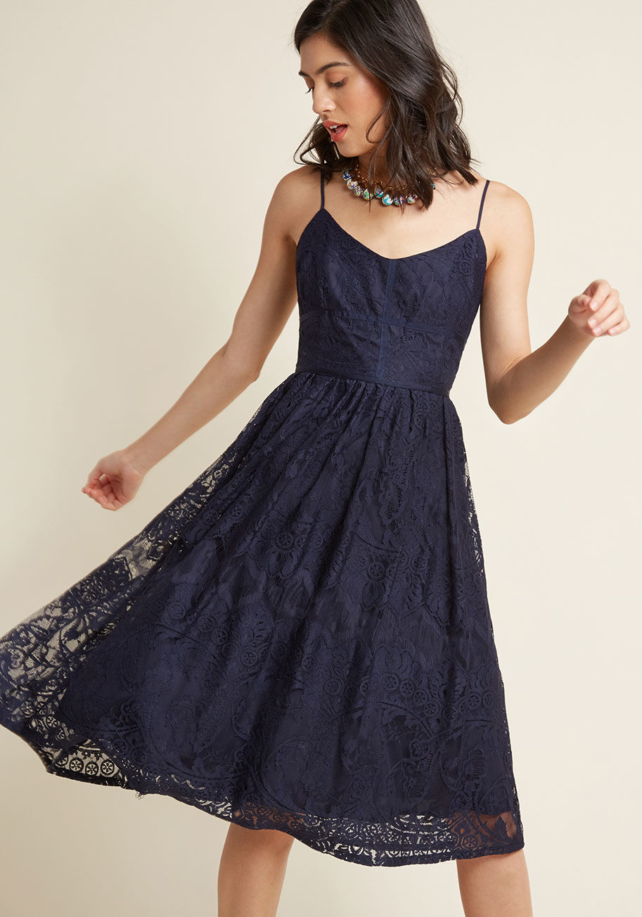  - Not much of your day ever goes unplanned, but with this navy blue midi dress