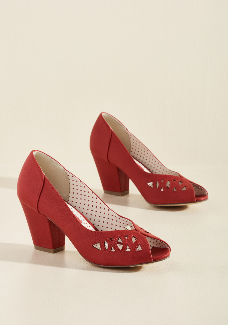  - Of course these red heels from B.A.I.T Footwear feel familiar - they embody all you love about a retro look! Fashioned with tapered midi heels to support their chic collections of cutouts and peep toes, these faux-leather stunners take you back