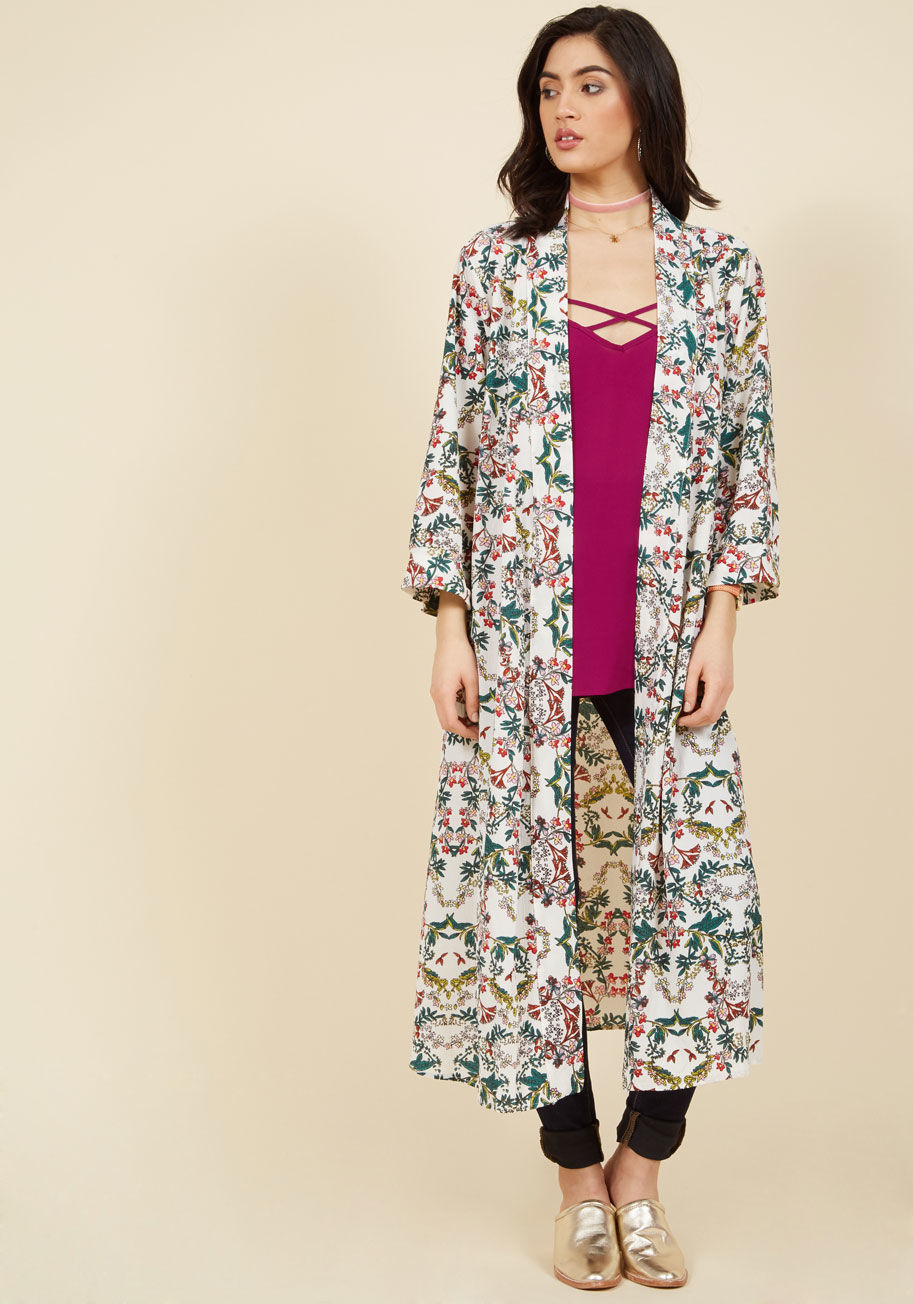  - One look at your ivory cardigan will seal the deal for poets, songwriters, and spoken word artists who are considering hitting the stage. The green, red, pink, and yellow viney wildflowers on this long layer from Compania Fantastica are eye-catching and i