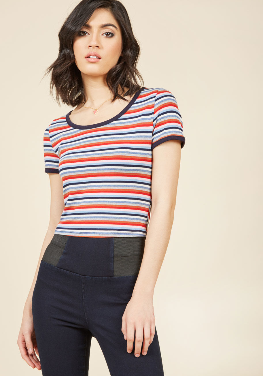  - One stellar way to spiff up a casual look is with the colorful stripes streaking this ModCloth-exclusive tee! Grey, orange, periwinkle, and pink are just a few of the hues found on this scoop-neck crop top, which touts navy blue trim and a heroic helping 
