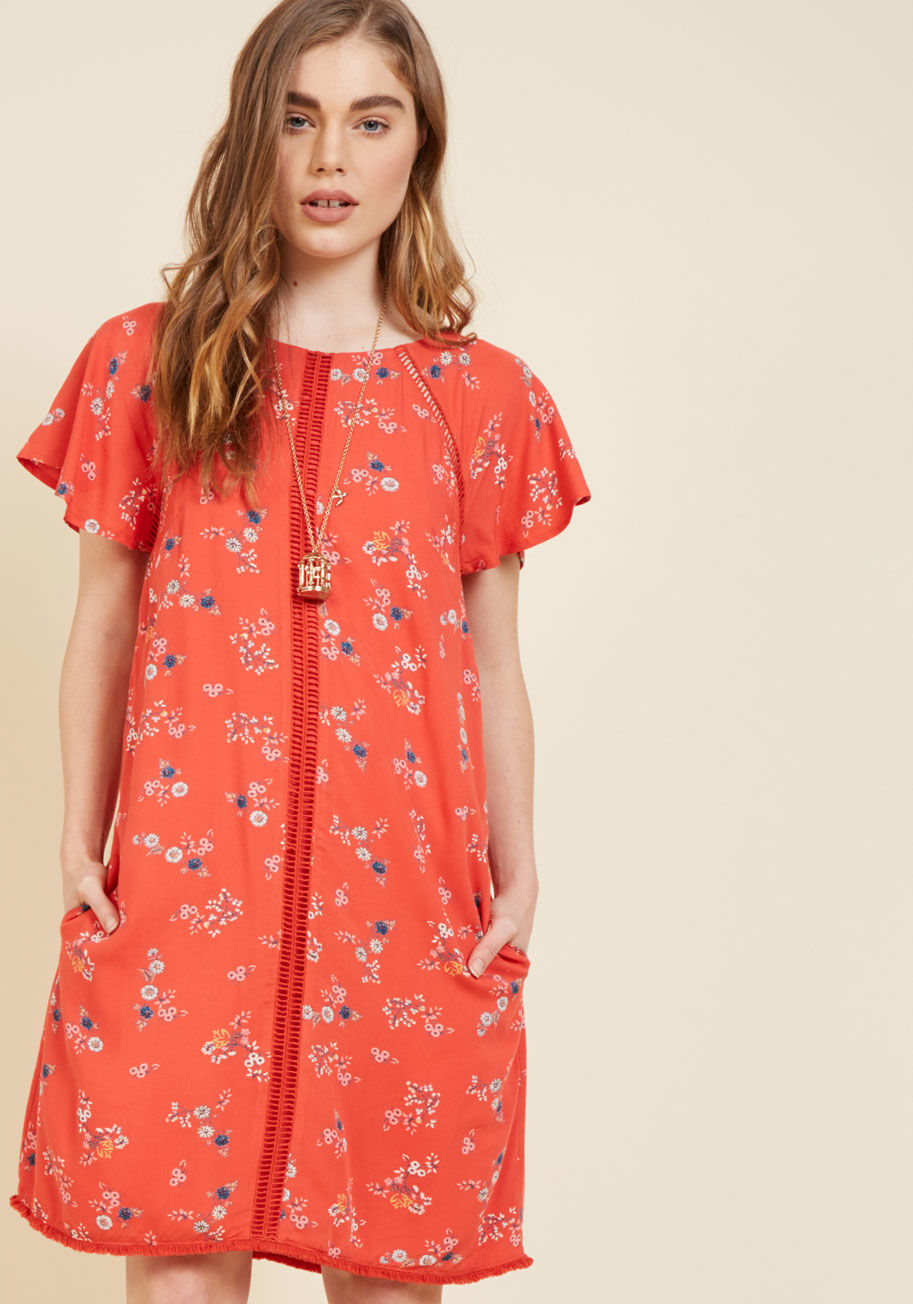  - Opening your wardrobe to rediscover this flirty shift dress each day is nothing short of a pure delight! A coral red hue highlights the petite florals that pattern this flowy dress, while hidden pockets, fluttery sleeves, and ladder piping at the shoulder