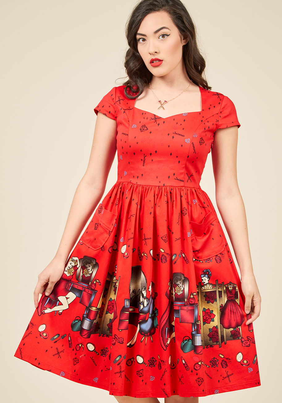  - Our favorite part about this bold red dress from Banned is its sweetheart neckline. Also its cap sleeves and buttoned back keyhole. Oh, and the patch pockets perched below its gathered waist. Wait, but we also absolutely adore the stars, bobby pins, and d