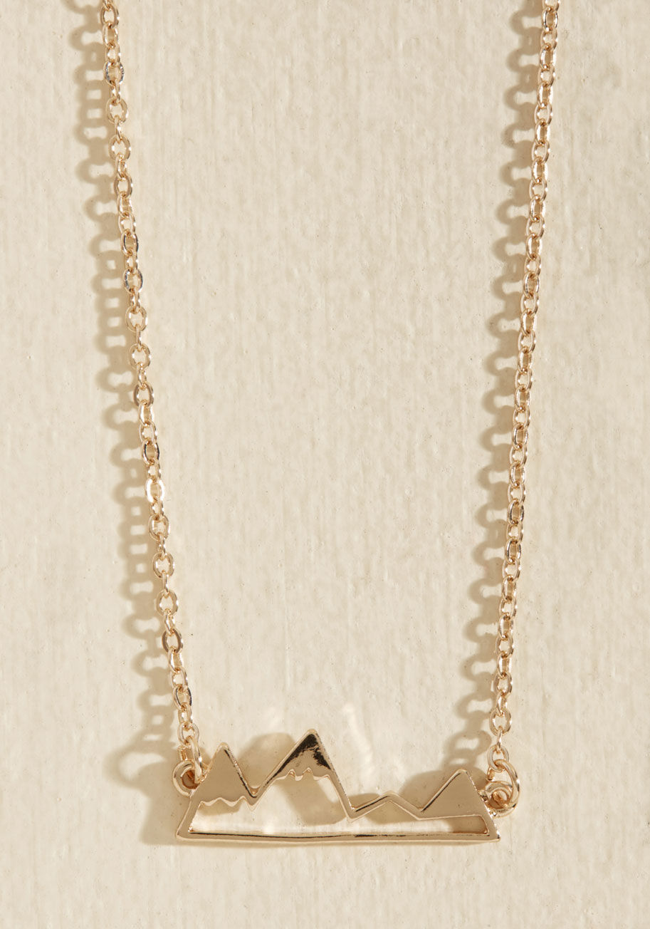 Slip on this sweet gold necklace - which dangles a snow-topped mountain range pendant from a delicate cable chain - and let your imagination climb up to the highest heights. by 