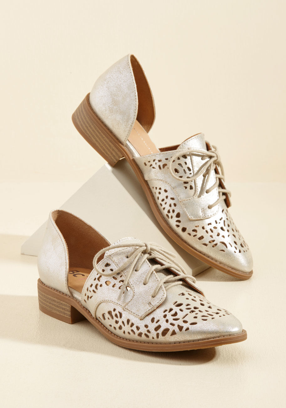  - Slip your feet into these metallic champagne flats by BC Footwear, and your strut will ascend to its very best! Livening up their derby shape with an unconventional d'Orsay silhouette punctuated with perforations, these vegan faux-leather kicks won&rsquo;