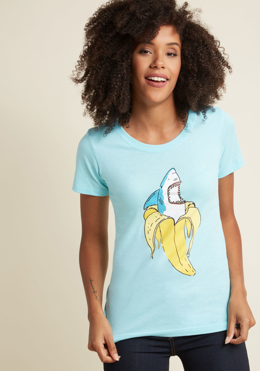  - Something seem a little off about your afternoon snack? Watch out - your banana might attack! With exactly that scenario screen printed on the front, this aqua graphic tee is the epitome of quirky!