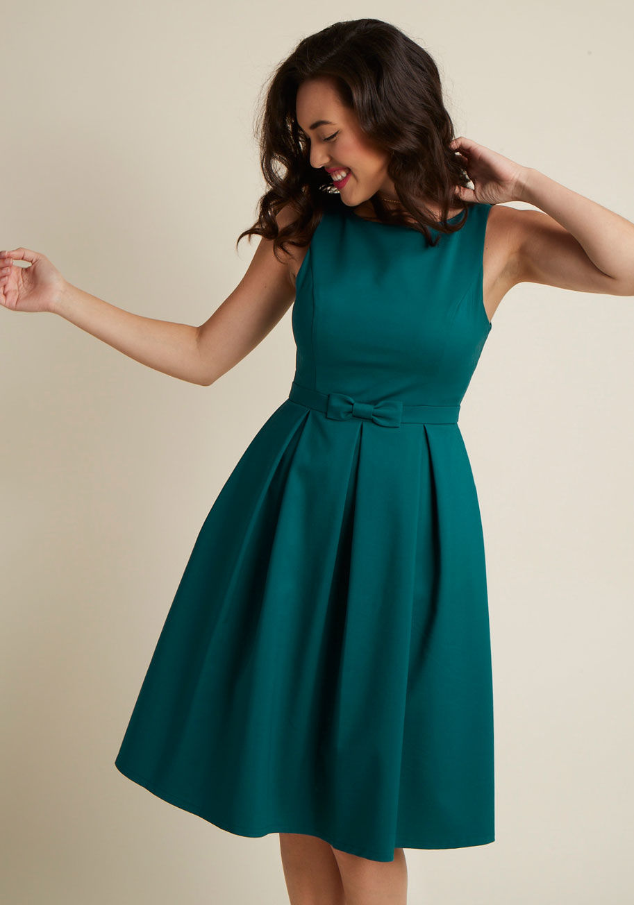  - Spreading your style over a series of fancy occasions is simple with this teal A-line dress - a ModCloth exclusive! Its vintage-inspired vibe is perpetuated by a high neckline, padded bust, princess seams, and bow-topped waistline. Add