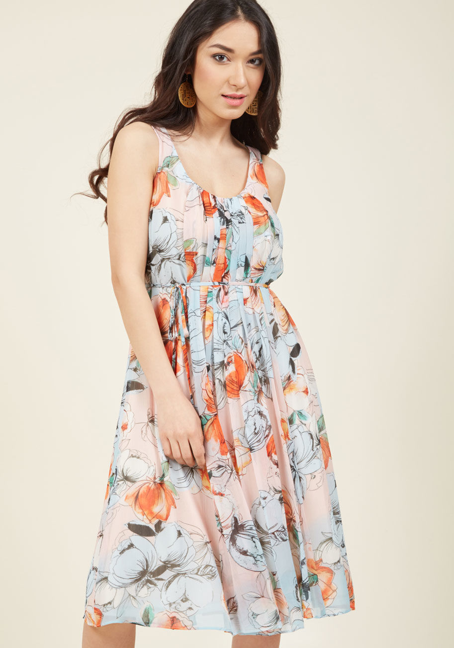  - Strolling through midtown, you can&rsquo;t help but give this floral dress by Donna Morgan a spin! As you enjoy every moment of this sweet scene, the tied sash and lush pink-and-blue chiffon of this pleated beauty flutters with you, earning you a flurry o