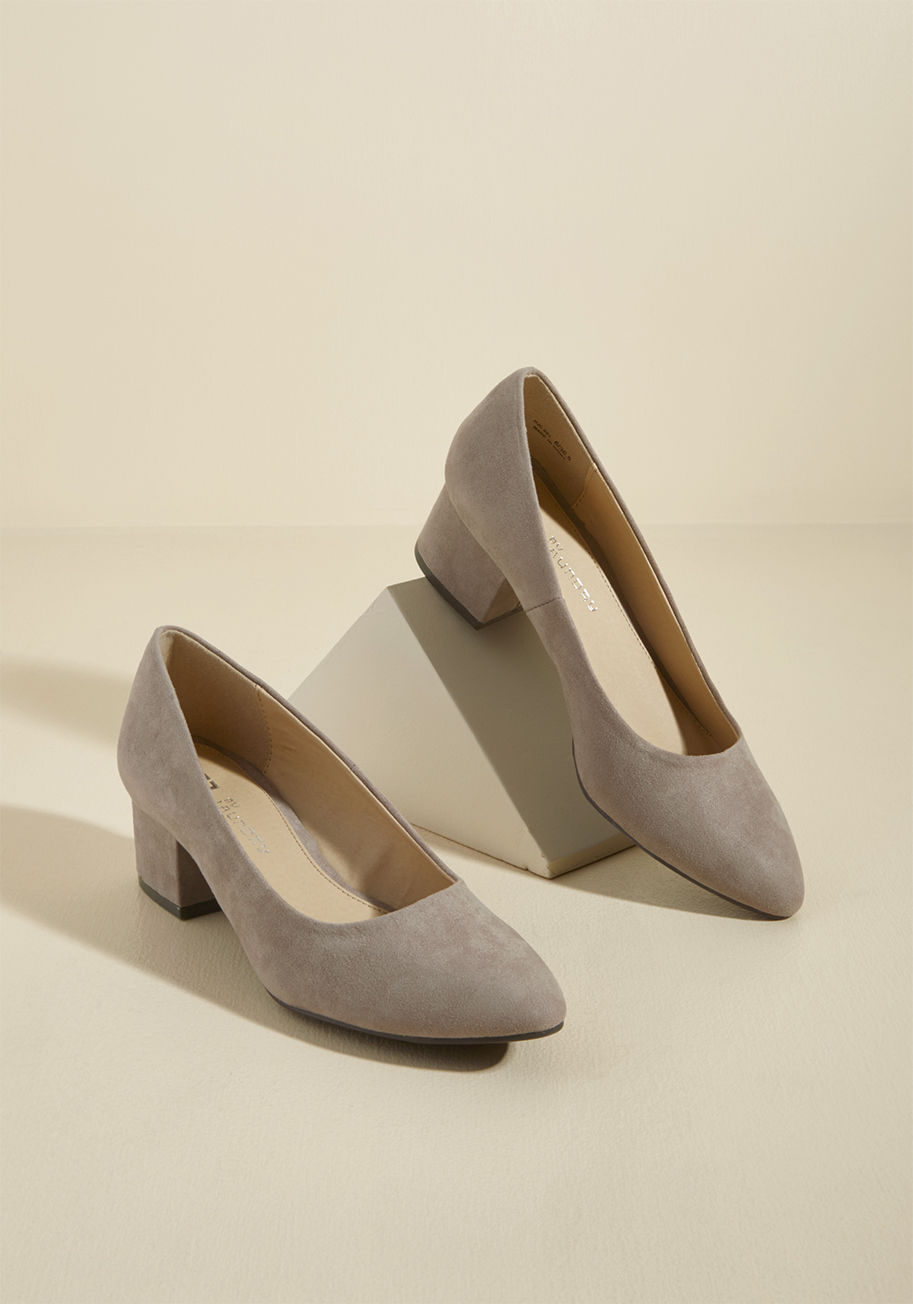  - Sweet and straightforward, these taupe block heels communicate your taste for life's simple joys. With subtly pointed toes, a vegan faux-leather finish, and a versatile vibe, these timeless pumps maintain the effortless air embodied by your style!